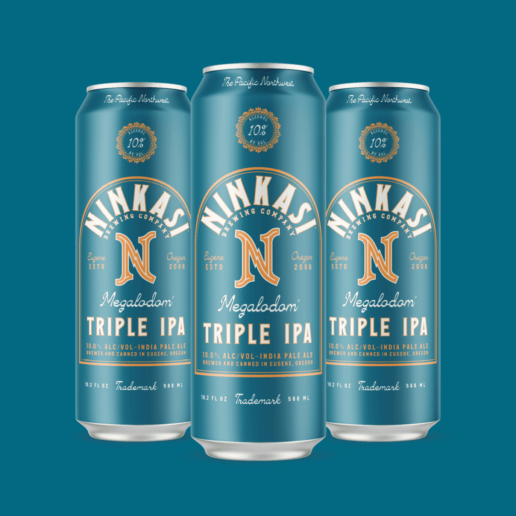 Three tall cans of Ninkasi's "Megalodon Triple IPA" displayed against a teal background. The cans are adorned in shades of teal and orange, showcasing the beer's origin in Eugene, Oregon, since 2006. Each can prominently features the label "10% ALC/VOL", indicating its alcohol content, and "The Pacific Northwest" is printed at the top, highlighting its regional roots. The design emphasizes the beer's triple IPA distinction, and each can contains 19.2 fl oz.