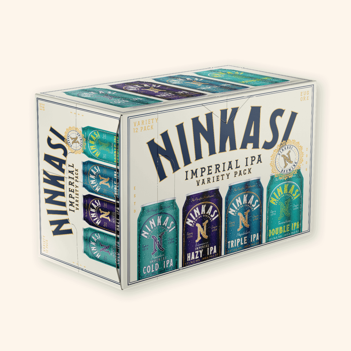 A 12-pack box of Ninkasi Imperial IPA Variety Pack. It shows three types of India Pale Ales: Total Domination IPA, Tricerahops Double IPA, and Maiden the Shade Summer IPA. The packaging is white with prominent blue and gold accents, featuring large Ninkasi branding and the brewery's crest. The words "COLD.," "HAZY.," and "TRIPLE IPA" suggest the different characteristics of the beers inside. Brewed in Eugene, Oregon, this collection showcases a range of hop-centric craft beers.